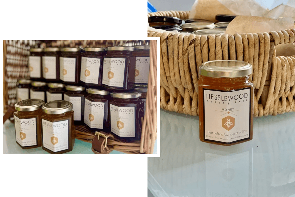 Jars of honey labelled Hesslewood Honey, in wicker baskets