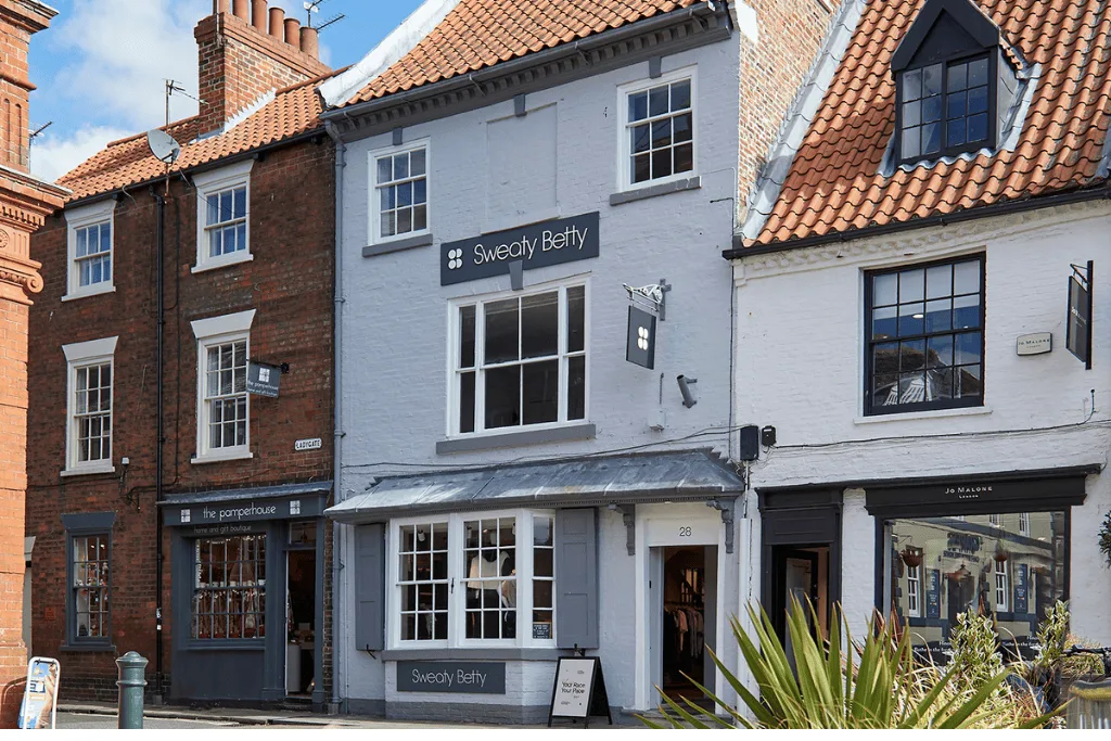 A photo showing a row of period styled built, terrace shops