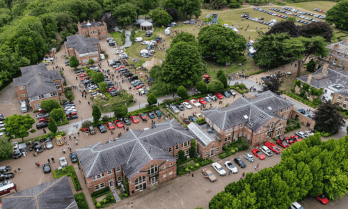 Aerial view of Hessleood Office Park and the parkland. Shows cars on display, crowds of attendees and stall holders