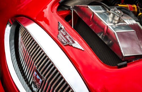 Classic Cars at Hesslewood 2026 Close up, of the front grill and partial engine, of a red Autin Healey 3000Mk111 classic car